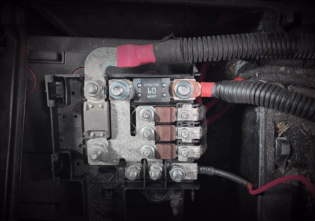 A photo of the the DC to DC charger installation on a bus bar on a Ram Promaster